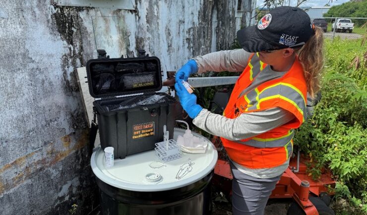 Woman pours works with chemical with a test kit