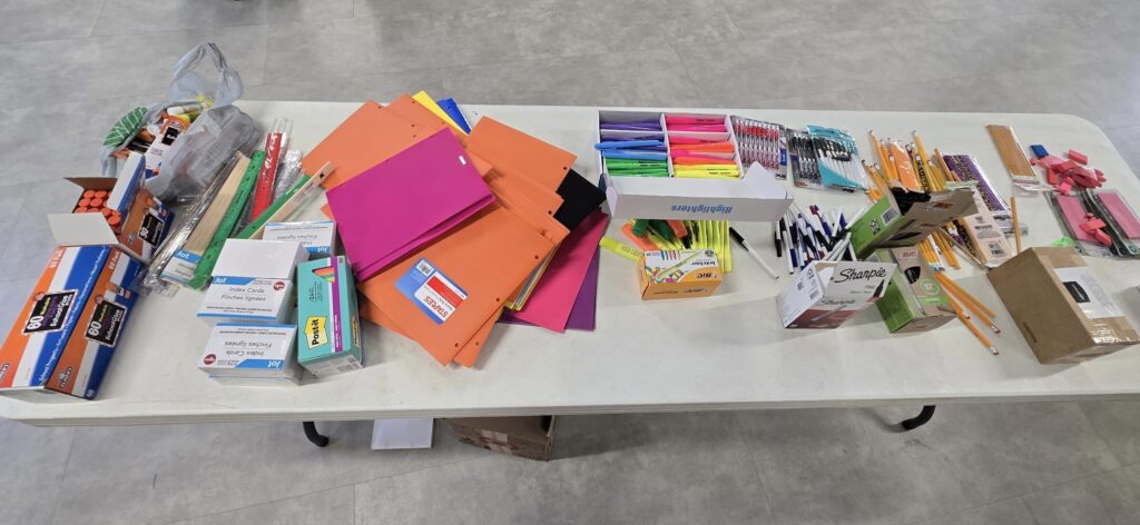 school supplies piled on a table