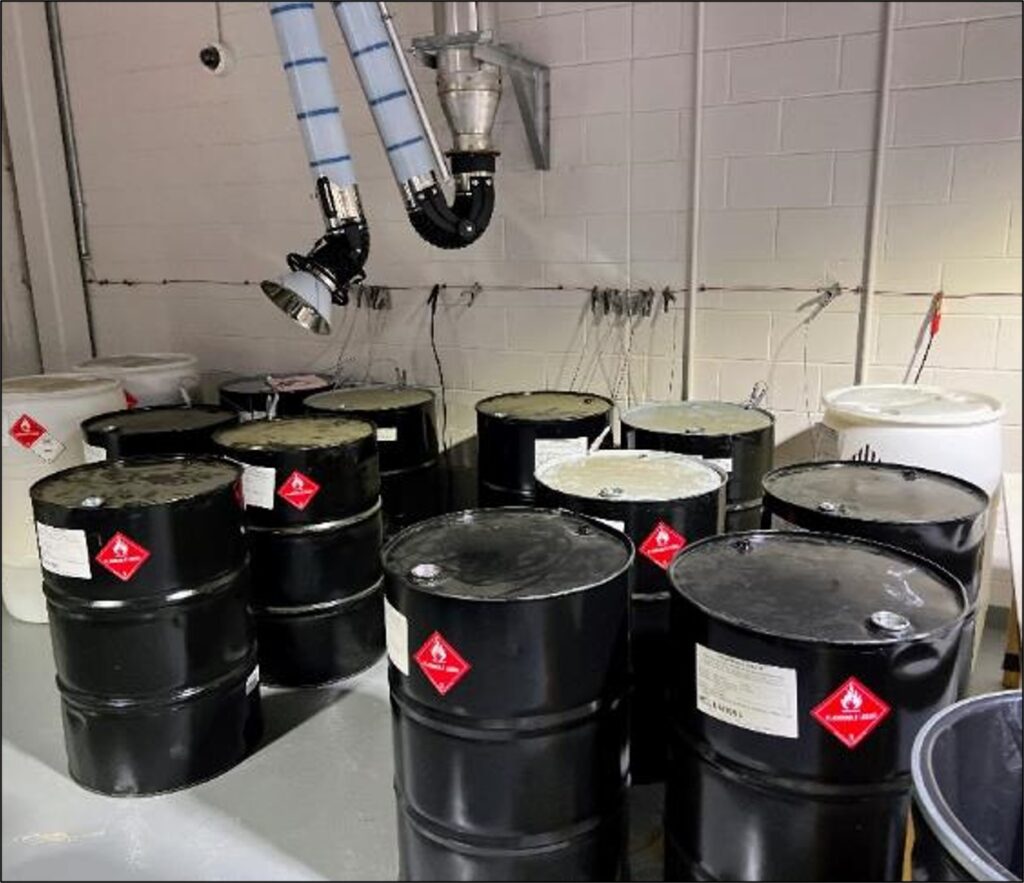 50 gallon drums labeled with hazardous material