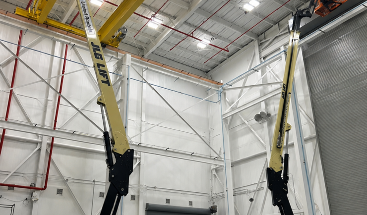 Two lifts in a clean warehouse