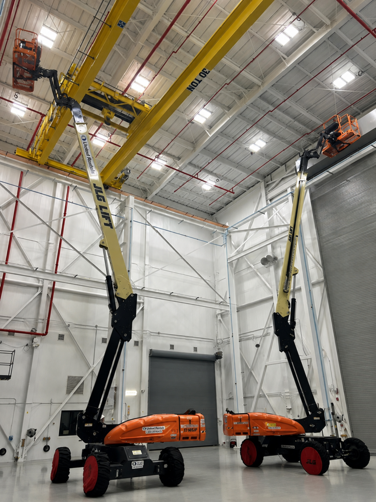 Two lifts in a clean warehouse